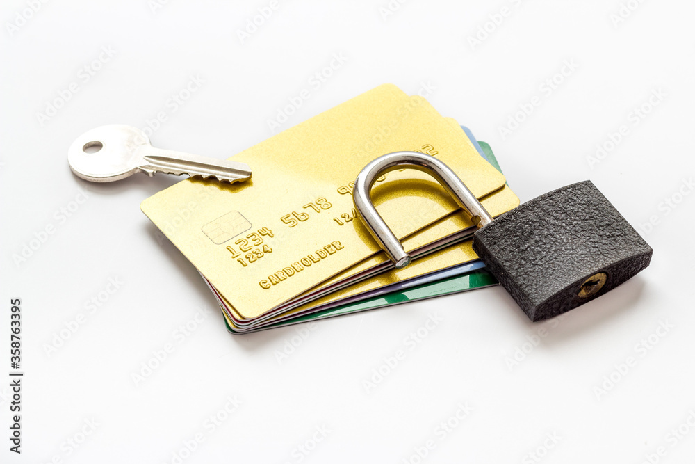 credit card hacked - security lock open - on white table top view credit card hacked - security lock open - on white table top view