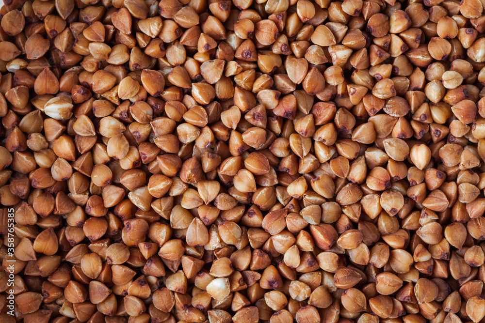 Macro overhead shot of buckwheat seeds as a background texture Macro overhead shot of buckwheat seeds as a background texture