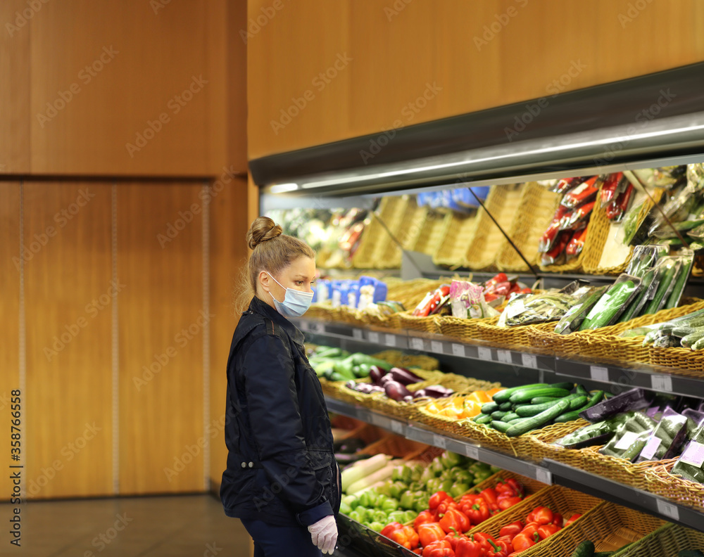 Supermarket shopping, face mask and gloves,Woman buying vegetables at the market