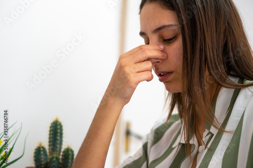 Woman with a nose pain. Sinusitis concept. Broken nose.