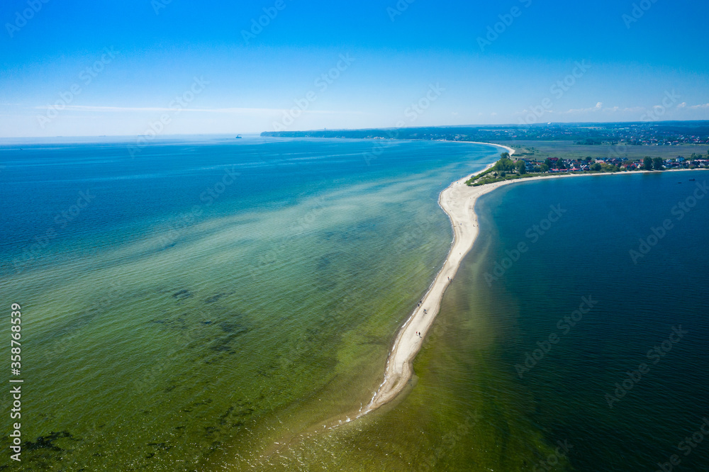 Rewa, Poland. Aerial view of Isthmus Rewski in summer at the Baltic Sea in Rewa, Pomeranian voivodship, Poland. Rewa, Poland. Aerial view of Isthmus Rewski in summer at the Baltic Sea in Rewa, Pomeranian voivodship, Poland.