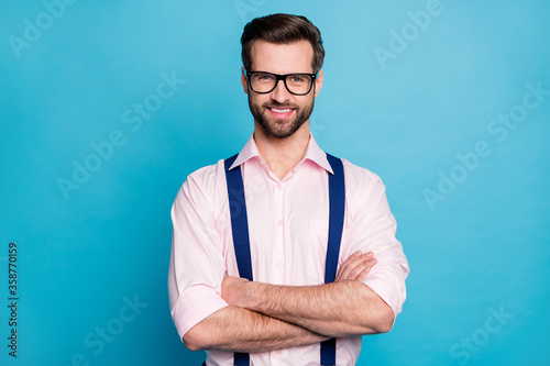 Photo of handsome macho cheerful business man cool trend clothes guy smile without teeth eyesight vision specs arms crossed wear pink shirt suspenders isolated pastel blue color background