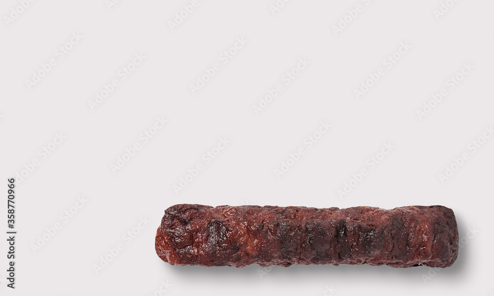 Grilled minced meat roll seekh kebab on a white background Grilled minced meat roll seekh kebab on a white background