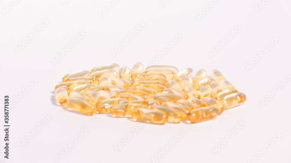 Omega 3 yellow soft gel pills isolated on white background. Omega 3 yellow soft gel pills isolated on white background.