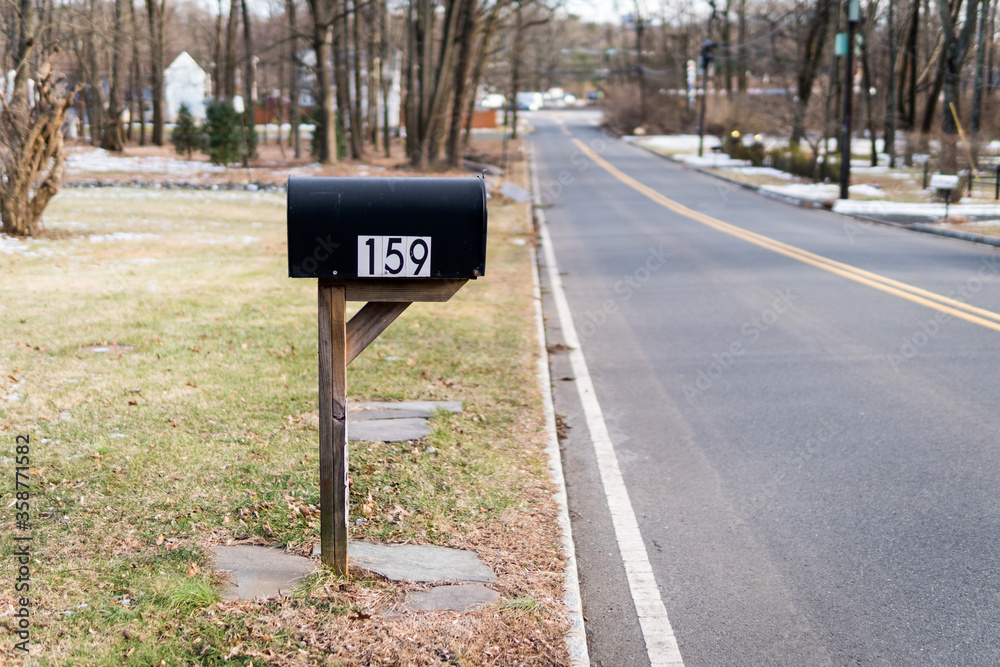 Black metal mailbox number 159 before Glenside Ave in Scotch Plains, New Jersey. Empty street. Cold winter. No traffic, no cars. Black metal mailbox number 159 before Glenside Ave in Scotch Plains, New Jersey. Empty street. Cold winter. No traffic, no cars.
