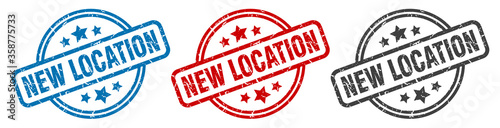 new location stamp. new location round isolated sign. new location label set