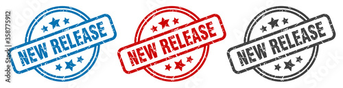 new release stamp. new release round isolated sign. new release label set
