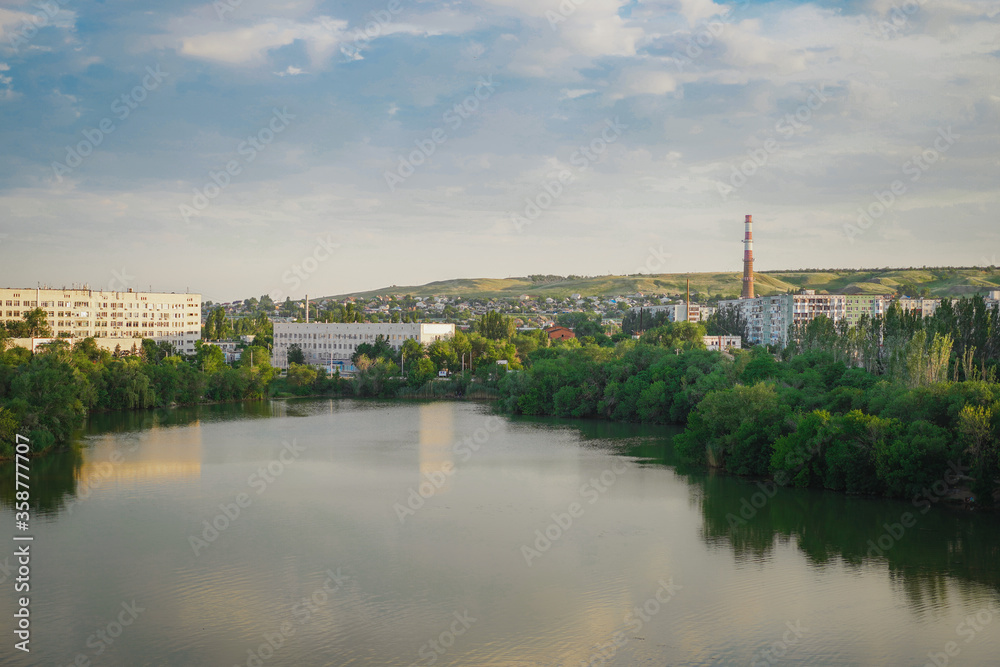 Peaceful panorama of the Russian city of Volgograd from the bridge, view of the mountains, high