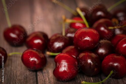 Fresh cherries on a wooden background
