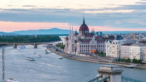 Time lapse with amazing view of Budapest with Parliament building, Chain bridge and Danube river at sunset. photo