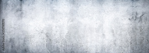 Texture of a grungy white concrete wall as a background or wallpaper