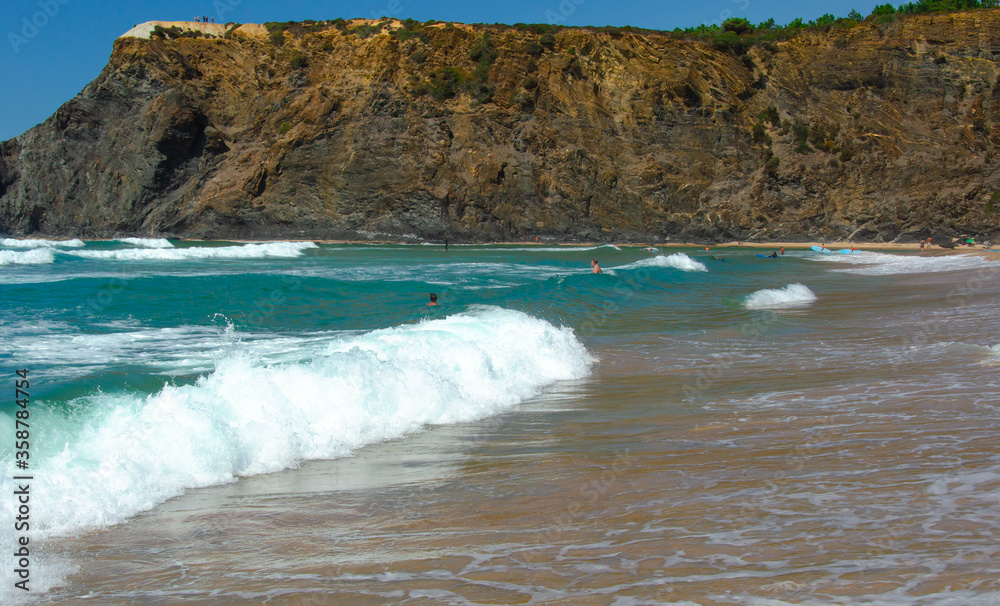 beautiful view of the beach coast of the Atlantic ocean in Portugal. Tourism and recreation. Waves break on the shore, banner. beautiful view of the beach coast of the Atlantic ocean in Portugal. Tourism and recreation. Waves break on the shore, banner.