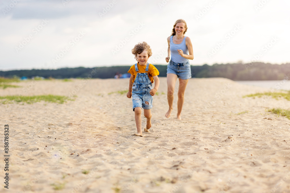 Mother and a child enjoying a day at the beach
Mother and a child enjoying a day at the beach