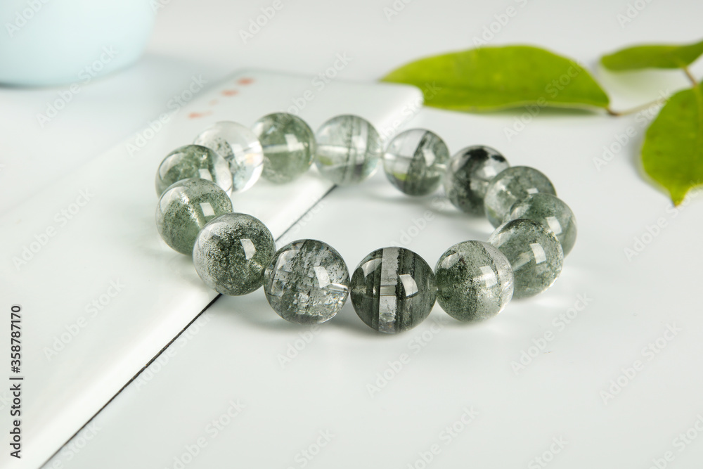 gem bracelet in front of white background
gem bracelet in front of white background