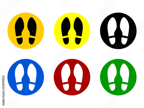 Set of Round Floor Marking Adhesive Sticker Icons with Different Colors and Shoeprints or Footprints for Queue Line or Other Purposes Requiring Social Distancing. Vector Image.