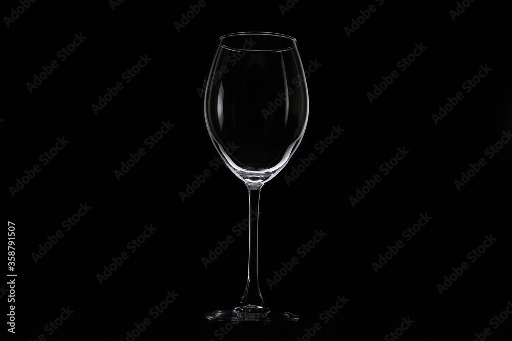 Empty glass for water, juice or milk on a dark background. Symbol of thirst. Close up. Empty glass for water, juice or milk on a dark background. Symbol of thirst. Close up.