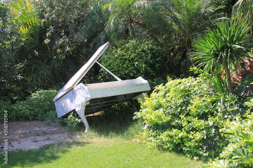 piano in the bushes.