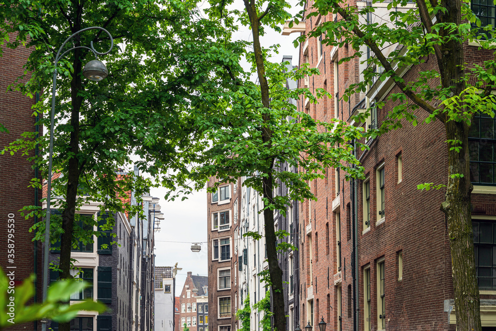 Fototapeta premium Beautiful street view of Traditional old buildings in Amsterdam,Netherlands