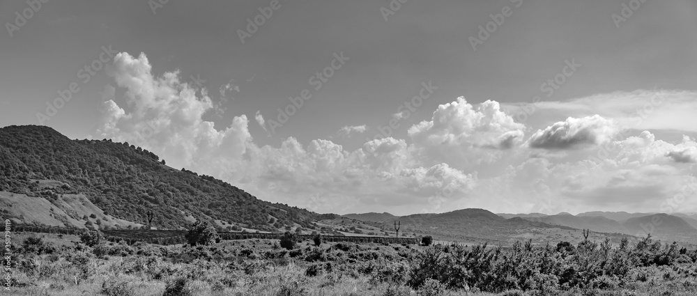 Black and white photo of mountains and plains.