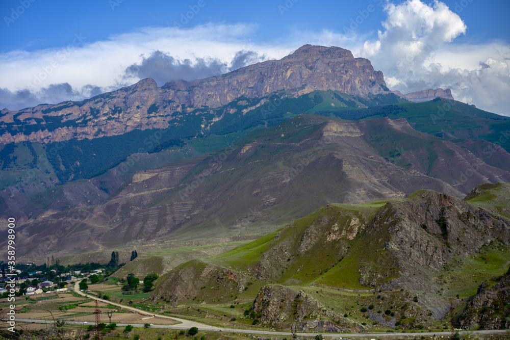 Rocky mountains on sky background