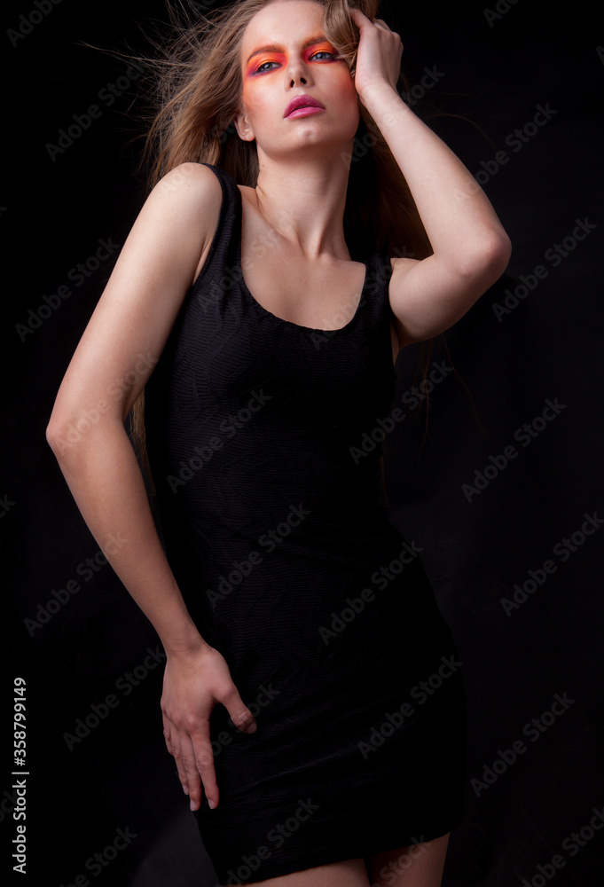 Young beautiful stylish girl posing in studio. Young beautiful stylish girl posing in studio.
