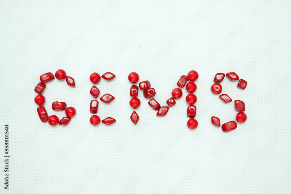 Red sign composed with red gems on white background. Red sign composed with red gems on white background.