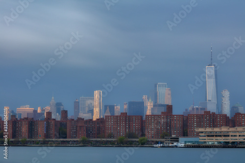 View on Lower Eastside from East River with long exposure at sunrise.