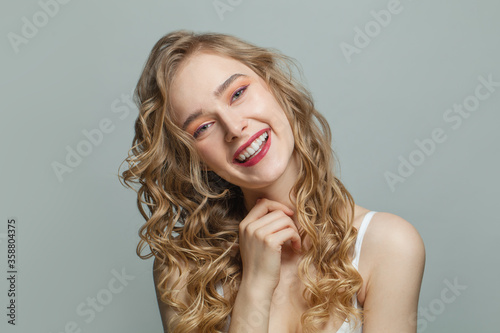 Pretty girl with blonde curly portrait