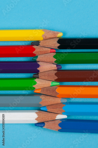 colored pencils on blue background