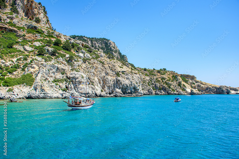 Boat trip in Mediteranean sea near coast of island of Rhodes (Rhodes, Greece)