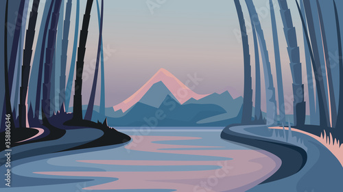 Bamboo forest on the background of mountains. Evening natural scenery.