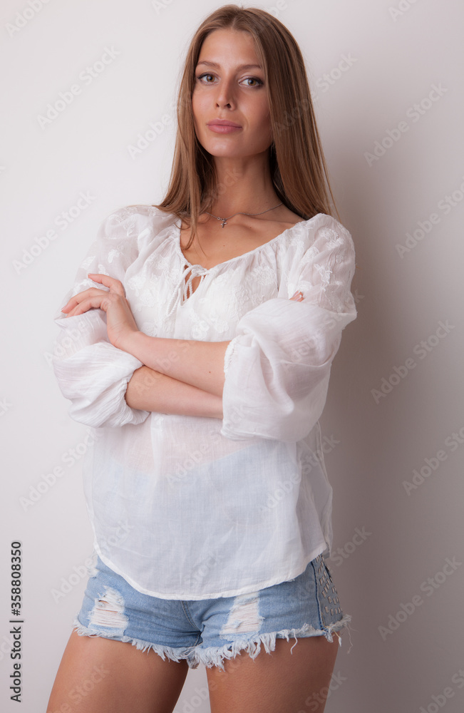 Young beautiful stylish girl posing in studio. Young beautiful stylish girl posing in studio.
