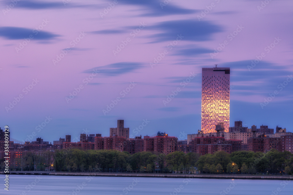Fototapeta premium View on Downtown Manhattan From East river with long exposure during sunrise