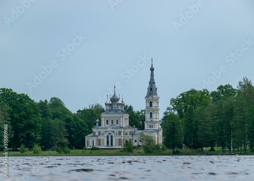 summer landscape with Lake Stameriena and Stameriena Orthodox Church in the background, Latvia photo