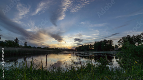 picture with beautiful colorful sunset over the lake, a wonderful place of strength and energy, peace, harmony and quiet