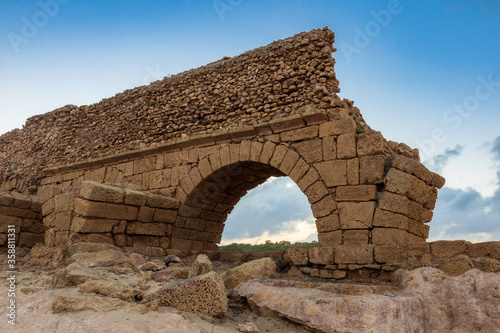 The destroyed aqueduct of the Herodian period. Caesarea, Israel. photo