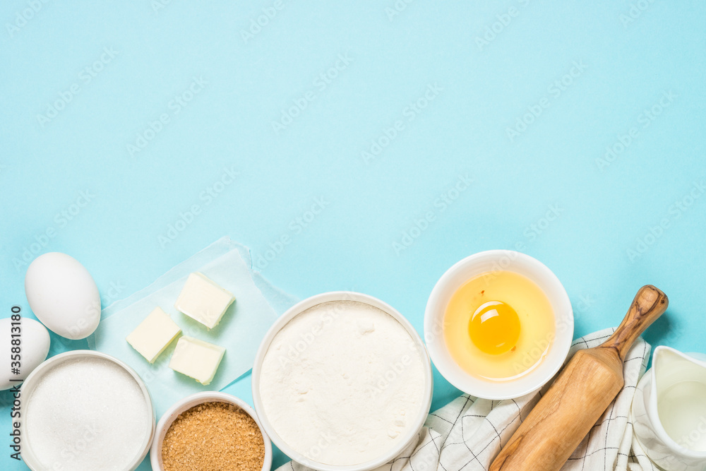 Baking ingredients at blue table top view. Baking ingredients at blue table top view.
