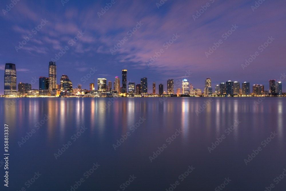 View on Jersey city skyscrapers at dusk with long exposure