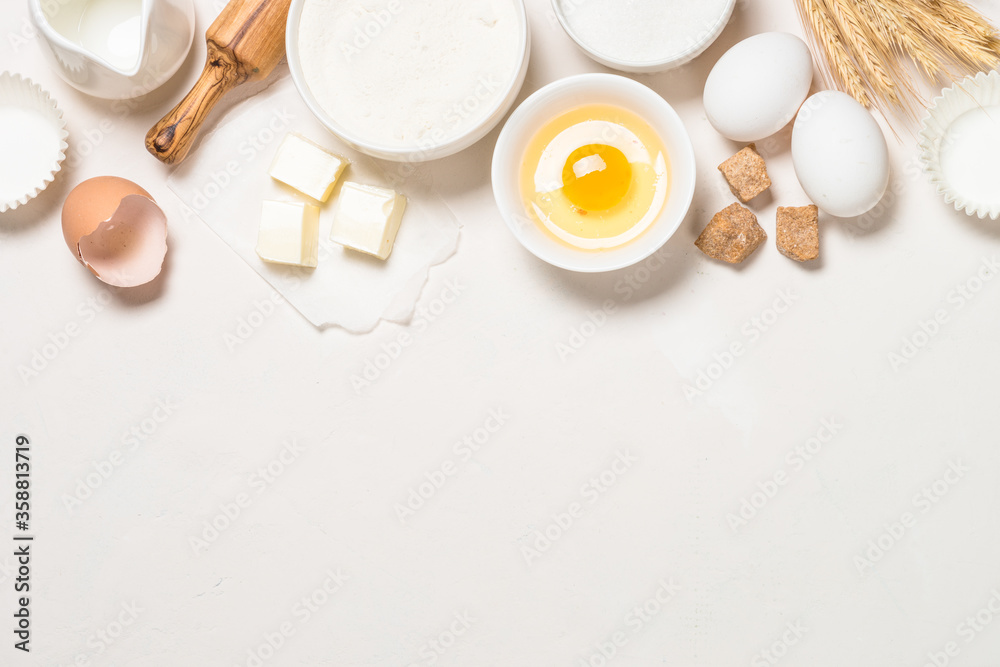 Fototapeta premium Baking ingredients at blue table top view.