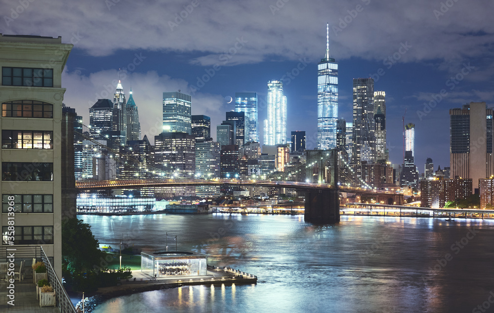 New York cityscape at night, Brooklyn Bridge and Manhattan seen from Brooklyn Dumbo, color toning applied, USA.