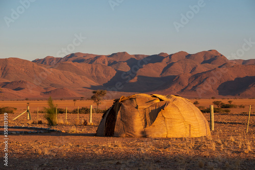 traditional hut in desert photo