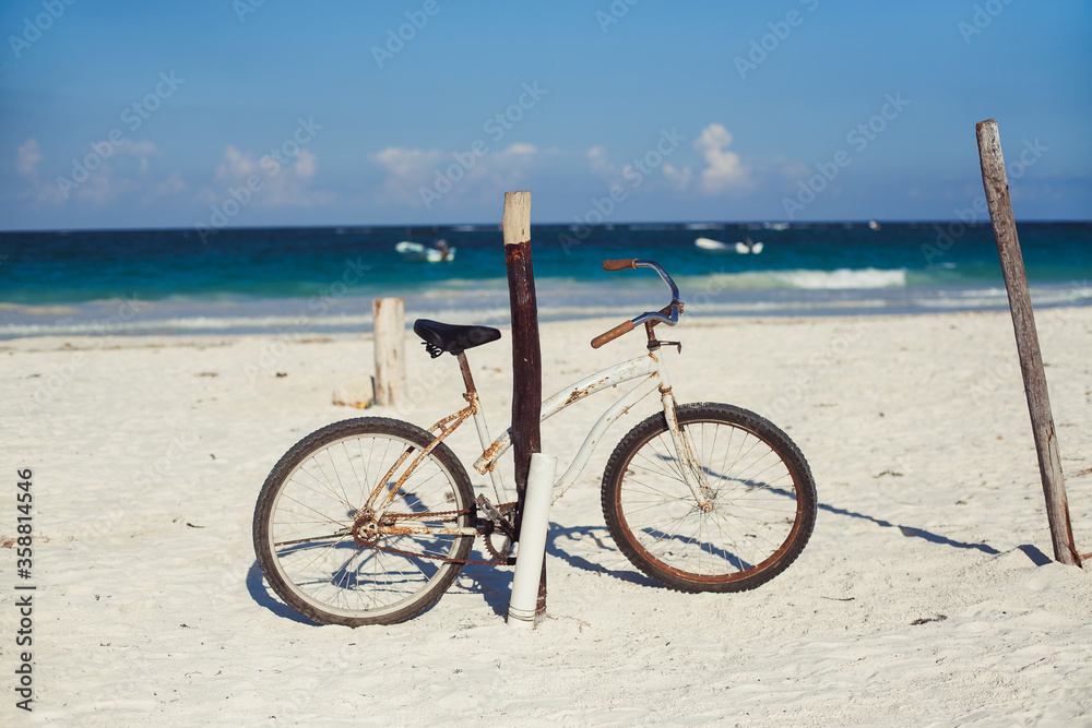 Cruiser bicycle on white sandy beach, Tulum, Yucatan, Mexico