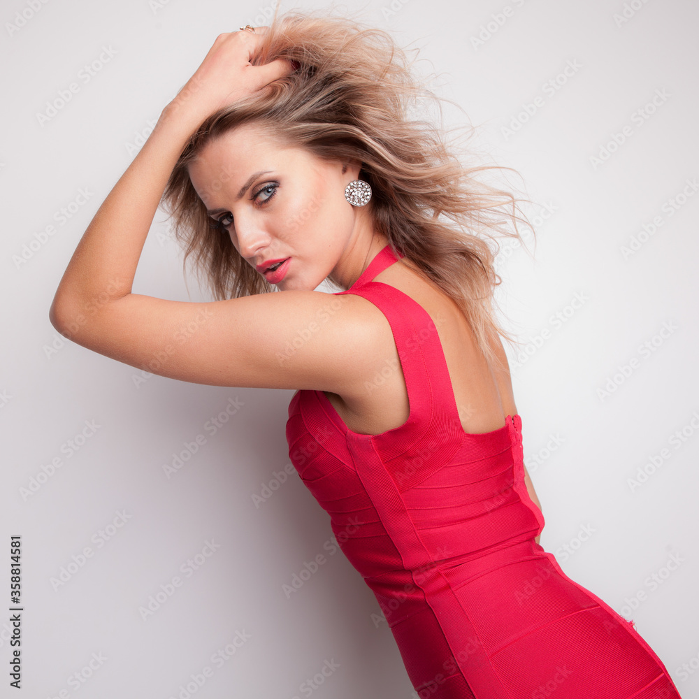 Young beautiful stylish girl posing in studio. Young beautiful stylish girl posing in studio.