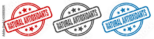 natural antioxidants stamp. natural antioxidants round isolated sign. natural antioxidants label set