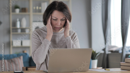 Headache, Tense Old Senior Woman Working on Project photo