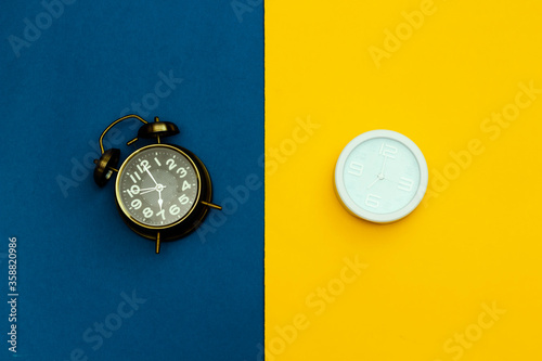 two different style of alarm clock and showing 7 am or pm