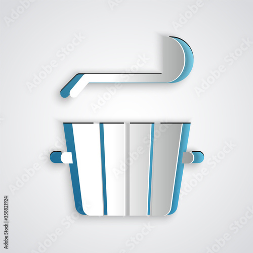 Paper cut Sauna bucket and ladle icon isolated on grey background. Paper art style. Vector