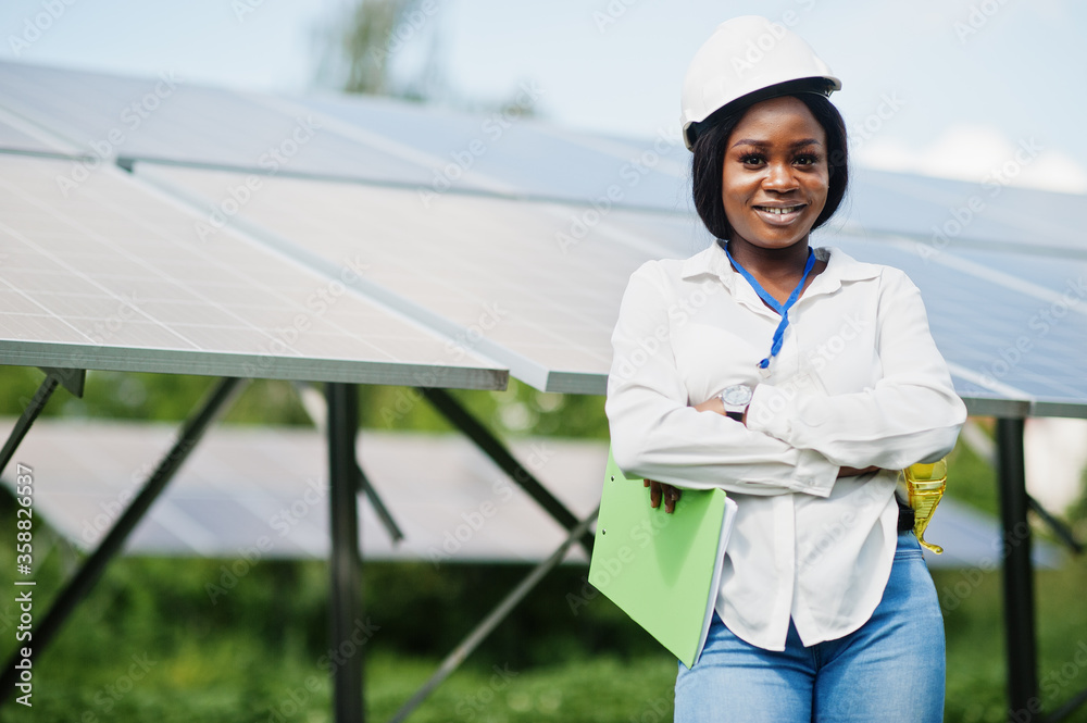 African american technician check the maintenance of the solar panels. Black woman engineer at solar station. African american technician check the maintenance of the solar panels. Black woman engineer at solar station.