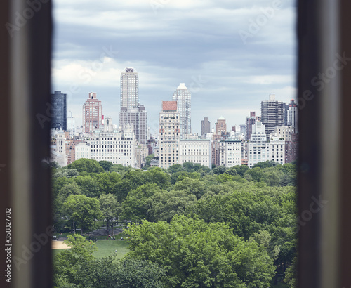 Central Park and Manhattan Upper East Side seen through a window, New York City, USA.
