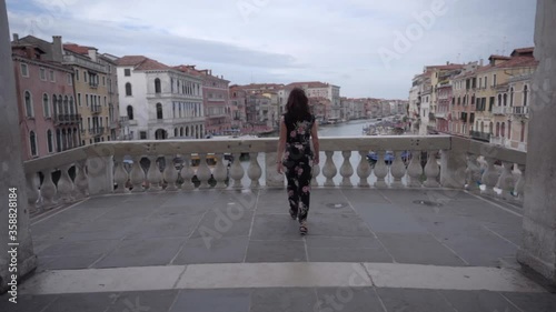 Wallpaper Mural Actractive young woman walk on the bridge of Rialto in Venice Italy looking at the Grand Canal Torontodigital.ca